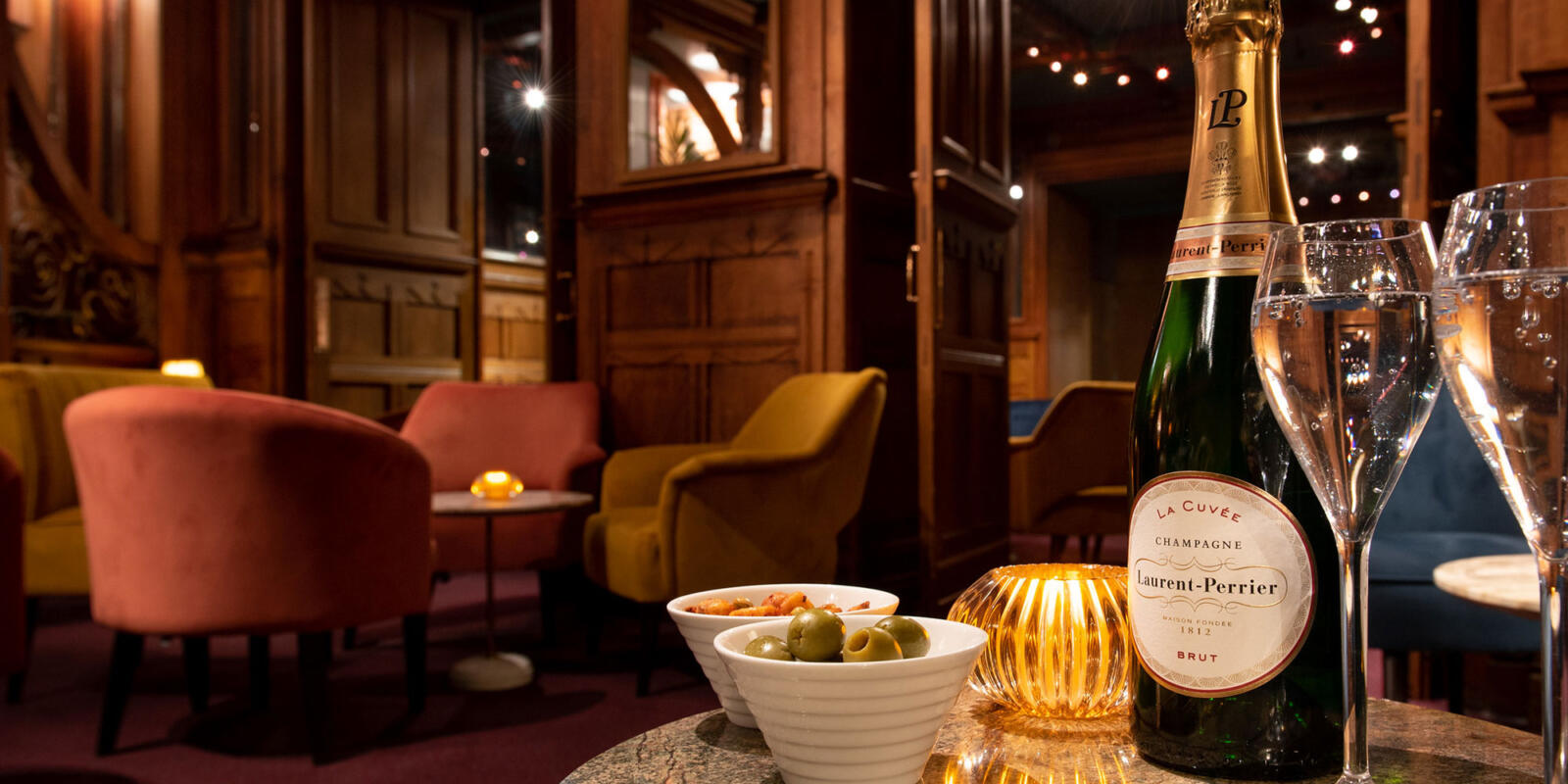 Image of a bottle of Laurent Perrier champagne in the American Bar room at the London Coliseum