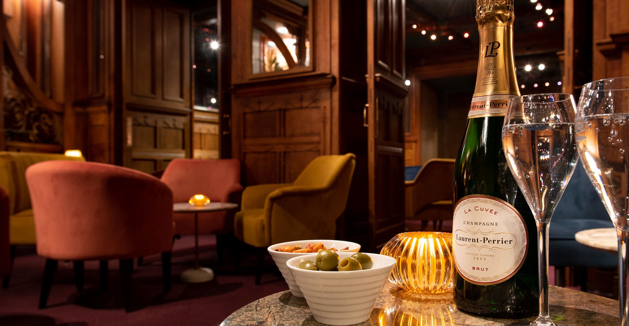 Image of a bottle of Laurent Perrier champagne in the American Bar room at the London Coliseum